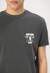 Tommy Jeans GRAPHIC TEE - Print T-shirt - black