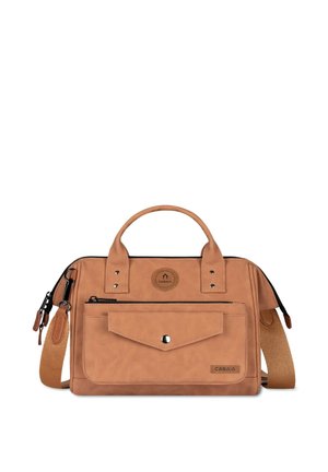 Tan handbag with two handles, a front snap pocket, zippered pocket, detachable shoulder strap, and small round Cabaia logo.