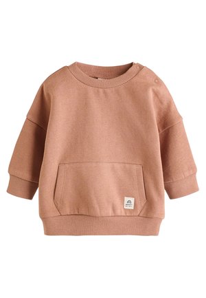 Bluza roz deschis din material moale. Prezintă un guler rotund, umeri căzuți, buzunar frontal, manșete striate și o etichetă mică cu logo.