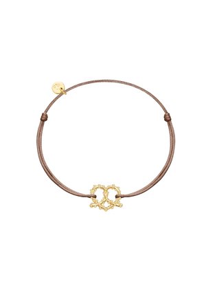 Brown cord bracelet with a gold-tone heart-shaped charm featuring intricate detailing and small bead accents. Adjustable closure detail included.