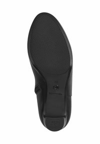 Semelle de chaussure noire avec motif de grip texturé, taille 37, marque "Tamaris" et étiquette "Anti Slide" au talon.