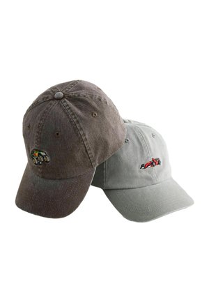 Two baseball caps, one brown with a small embroidered off-road vehicle, one gray with a small embroidered red race car, isolated on white.