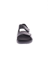 Black sandal featuring two adjustable straps, a contoured footbed, and a textured sole, with a sleek design for easy wear.