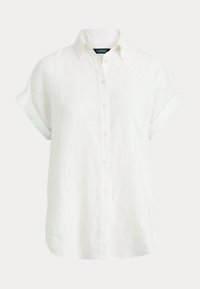 Bílá krátká košile s knoflíky z lnu. Má klasický límec, ohrnuté rukávy a volný střih pro lepší prodyšnost.