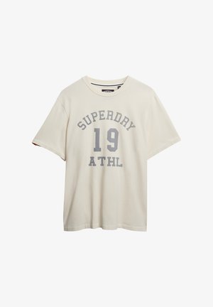 Crèmekleurig T-shirt van katoen, met een ronde halslijn en korte mouwen. Het heeft grijze bedrukte tekst: "SUPERDAY 19 ATHL."