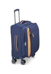 Valigia da viaggio navy con accenti beige, tessuto testurizzato, due cerniere frontali, manico telescopico e quattro ruote multidirezionali.