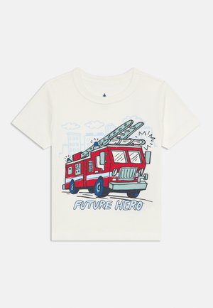 White children's T-shirt with a red fire truck illustration, city background, and the text "FUTURE HERO" below the truck.