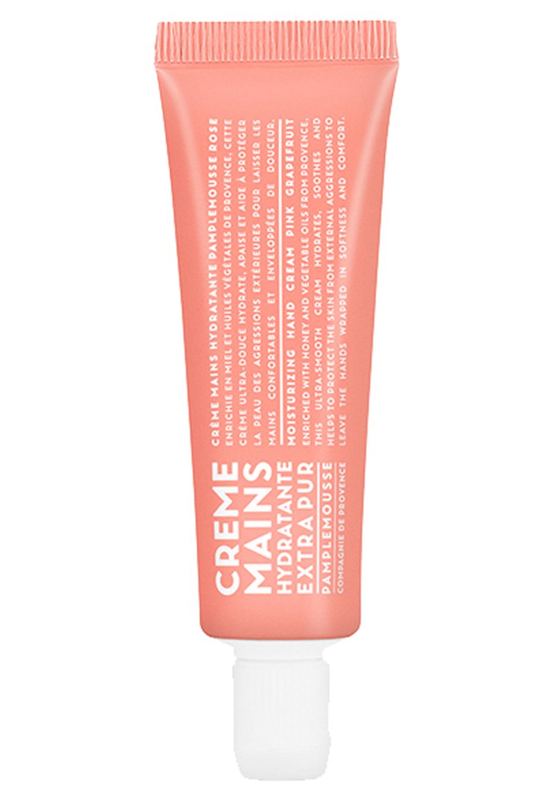 Pink hand cream tube with white text. Features a screw cap, smooth texture, and is labeled as moisturizing with honey and grapefruit.