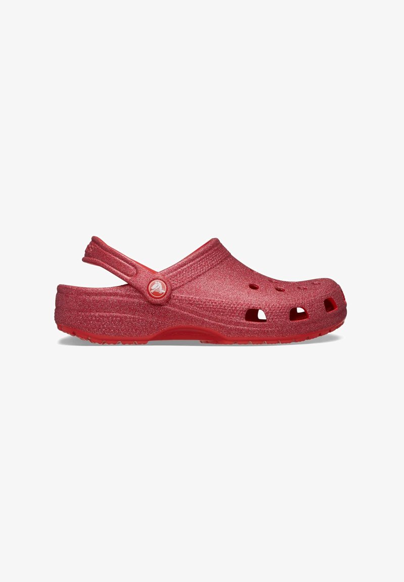 Red molded clogs with a glossy finish, featuring ventilation holes, a back strap, and a textured upper surface.