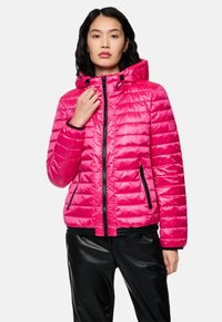 Fuchsia puffer jacket with quilted texture, zip closure, adjustable hood, and black accents; paired with black pants.