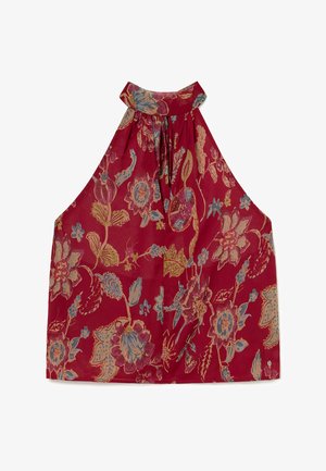 Haut rouge sans manches à col nageur avec un motif floral bleu, beige et rose et un col froncé.