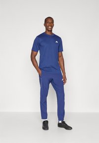 adidas Performance TECH APP - Træningsbukser - dark blue/glow blue