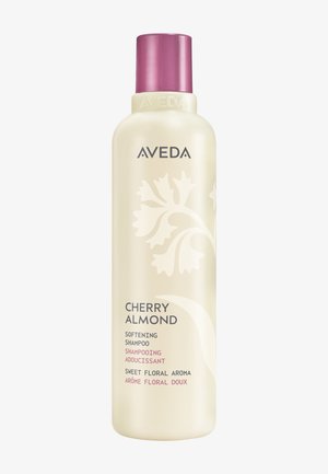 Flacon de shampooing adoucissant Aveda Cherry Almond avec un motif floral et un bouchon rose, étiqueté pour un arôme floral doux.