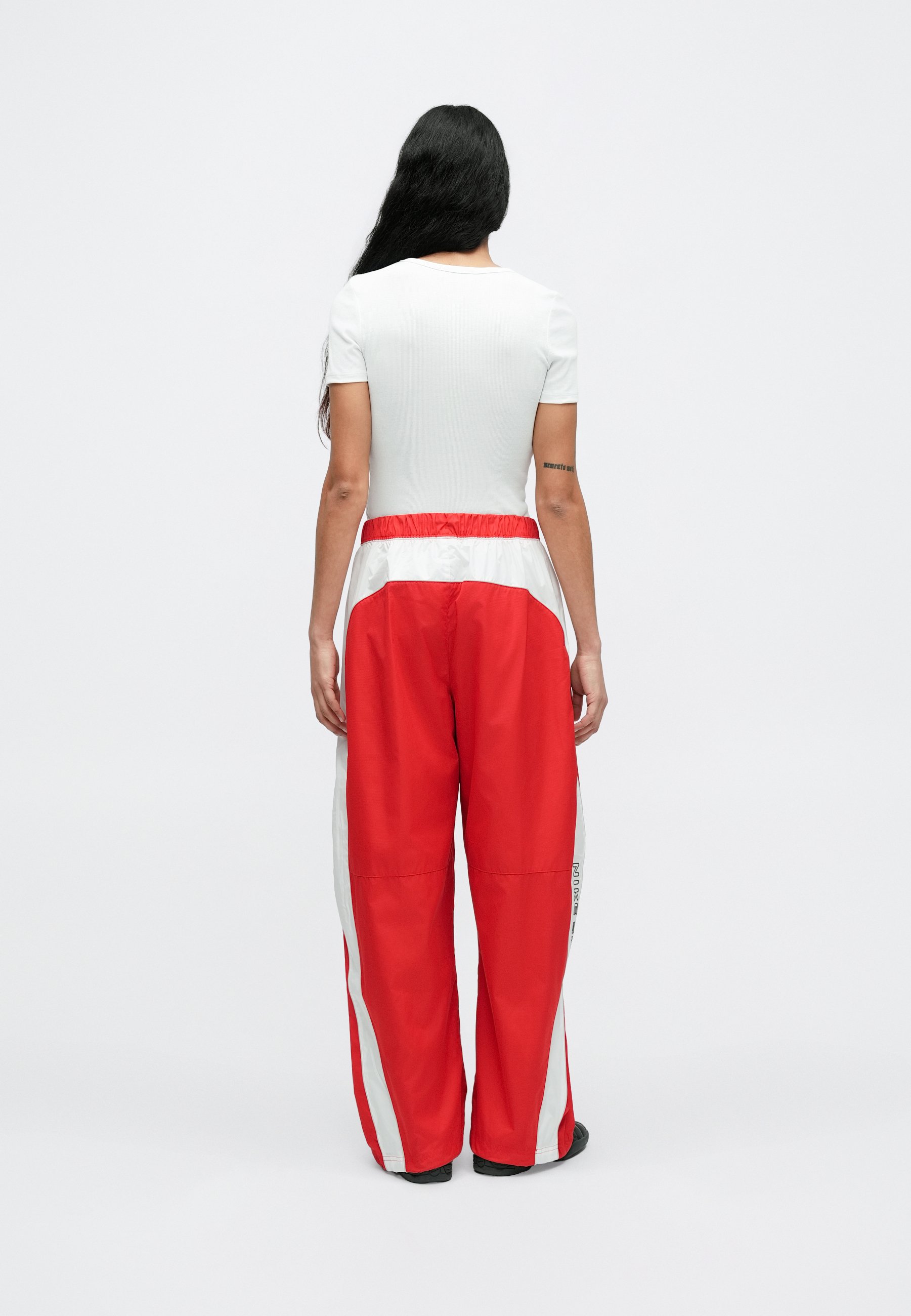 red and white nike pants