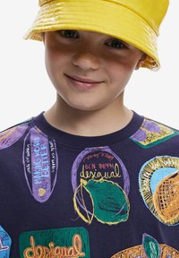 Purple cotton t-shirt with vibrant, multi-colored graphic designs and text. Yellow, glossy bucket hat with a wide brim.
