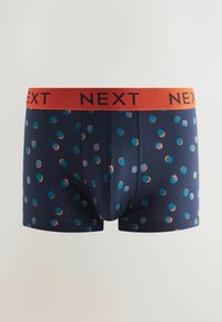 Boxers ajustados azul marino con un vibrante patrón de lunares en azul, naranja y rosa. La cinturilla elástica es de un rojo brillante con la marca "NEXT".