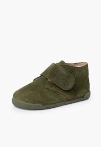 Green suede ankle boot with a wide velcro strap, round toe, and textured rubber sole. Simple design with stitching accents.
