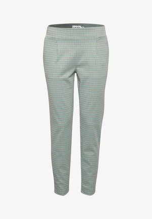 Rutig byxor i ljusblått med bruna detaljer, slät tyg, smalnande ben och en etikett i midjan. Har två fickor fram.