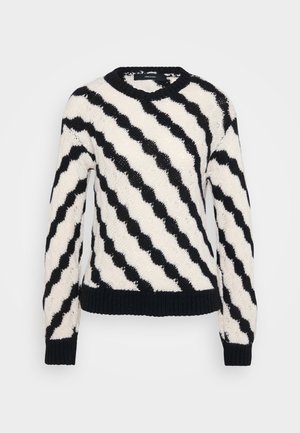 Black and white knitted sweater with diagonal wavy stripes, ribbed cuffs, hem, and crew neckline, displayed on a plain background.