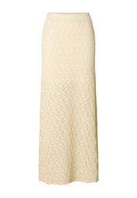 Maxi strikskirt i creme; har et diamantspidspattern, ribbet talje og en flydende silhuet. Tekstureret, letvægtigt stof.
