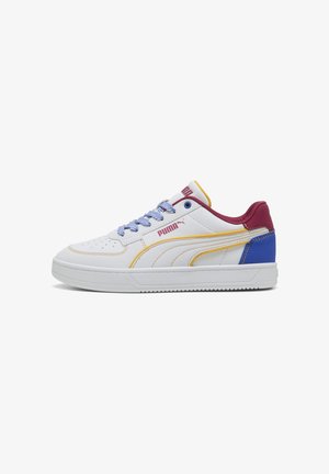 White sneakers with a textured upper, featuring yellow, burgundy, and blue accents, and a white rubber sole. Blue laces complete the design.