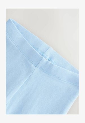 Svetlomodré bavlnené legíny s plochým pásom, hladkou textúrou a jednoduchým prešívaním pozdĺž švov.