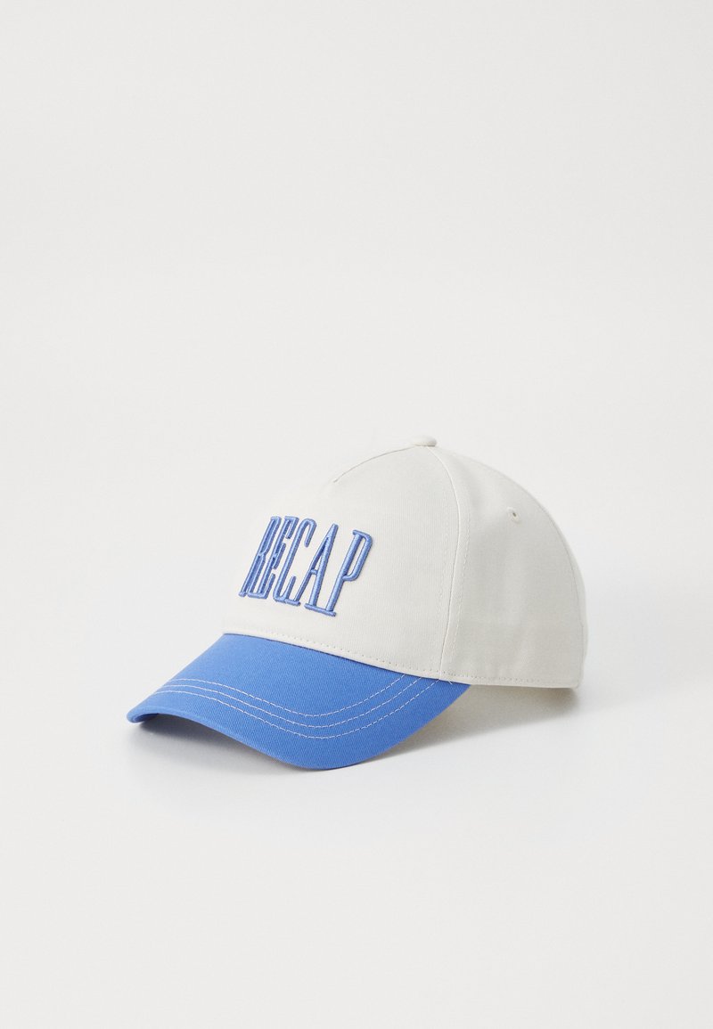 Beige baseball cap with a blue visor, featuring raised blue text "RECAP" on the front. Cotton material with a structured design.