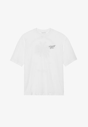 Weißes Baumwoll-T-Shirt mit einem lässigen Schnitt, kurzen Ärmeln und einem schwarzen Grafik-Print mit "Key West" auf der oberen linken Seite.