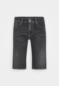 Mustat farkkushortsit klassisella istuvuudella, joissa on etutaskut, nappikiinnitys ja hieman kulunut pinta. Dobblattut polvien ylle.