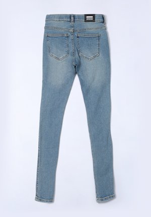 Blue denim skinny jeans with a smooth texture, five pockets, and a black waistband label. The design features a classic denim wash.