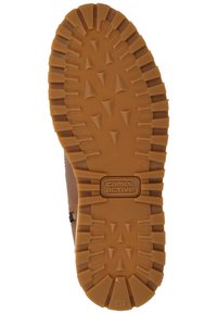 Rubber shoe sole with deep treads and a camel-colored finish. Features triangular patterns and "camel active" branding. Size 41.
