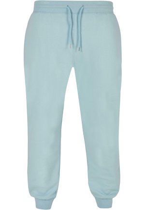 Lysblå sweatpants lavet af blød stof, med elastisk talje og snor, samt tapered manchetter ved anklen.