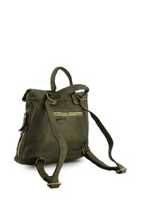 Olive green leather backpack with a smooth texture, top handle, adjustable straps, front zip pocket, and gold-tone hardware accents.