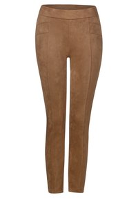 Bruna faux suede leggings med en smidig textur, hög midja och två framfickor. Utformade för en figurnära silhuett.