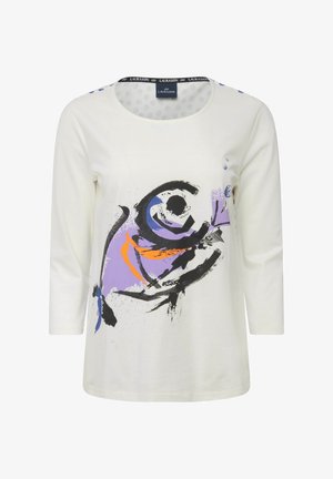 Camisa blanca de manga larga con un diseño abstracto colorido en púrpura, naranja y negro. Cuello redondo con una banda estampada.