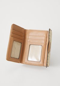 Brown leather wallet with multiple card slots, two transparent ID windows, and a woven exterior texture. Compact fold design.