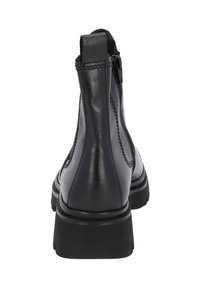 Black leather ankle boot with elastic side panels, rounded toe, and a textured rubber sole. Features a pull tab at the back for easy wear.