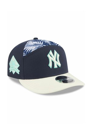 Navy and white New York Yankees snapback cap with palm leaf pattern on top panels and light blue team logo on front and side.