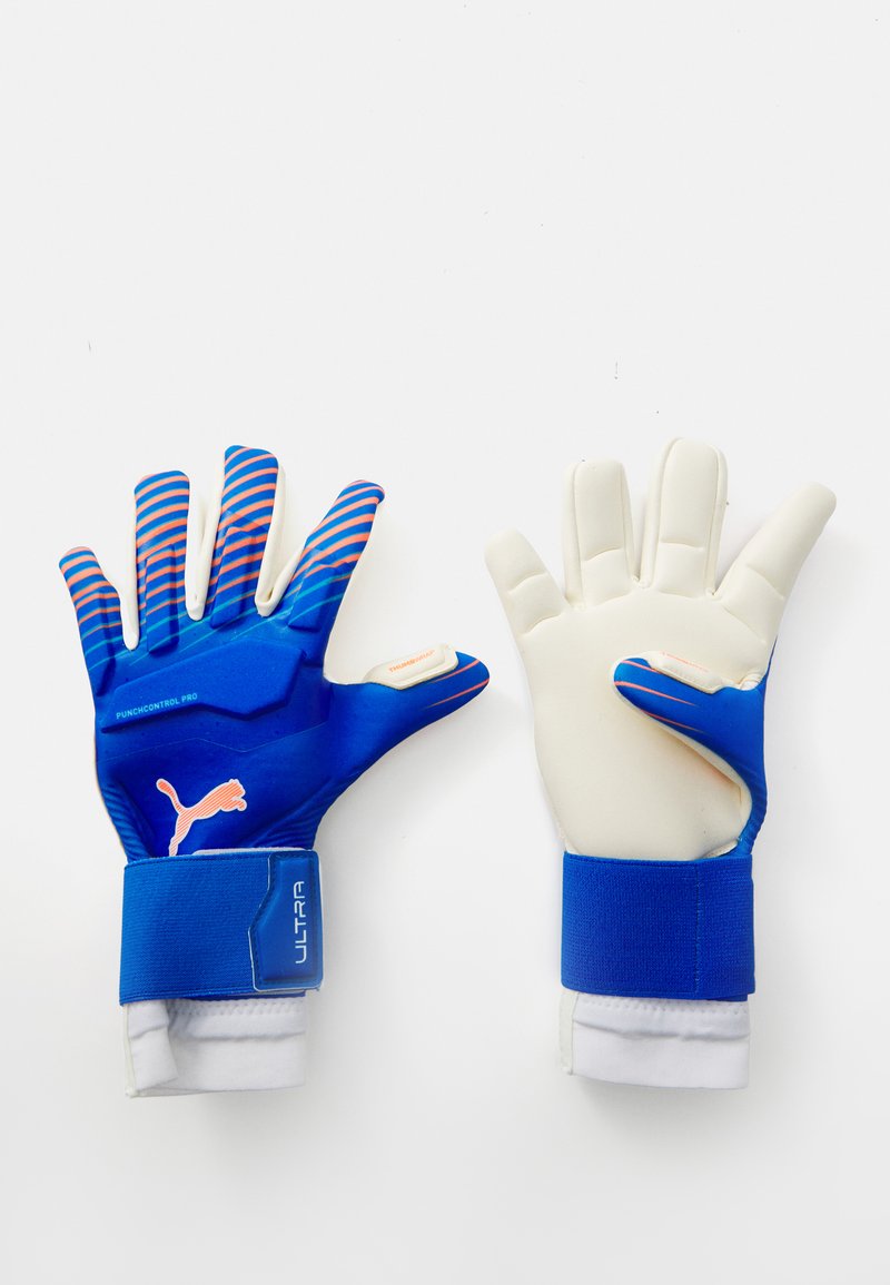 Blue goalkeeper gloves with white latex palm, textured grip, striped blue and pink accents, elastic wrist cuffs, and branding details.
