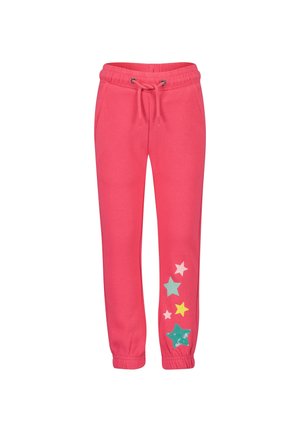 Růžové tepláky se stahovací šňůrkou v pase, s hvězdnými vzory v různých barvách a texturách na levé noze. Elastické manžety.