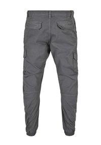 Grijze cargo pants met elastische manchetten, meerdere zakken en een relaxte pasvorm. Gemaakt van lichte stof, met een gladde textuur en gestikte naden.