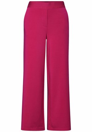 Fuchsia weite Hose aus weichem Stoff mit elastischem Bund, der erhabene Buchstaben aufweist, und ohne sichtbare Taschen oder Verschlüsse.