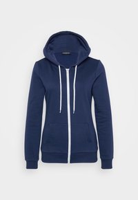 Marineblå hettegenser med hvite snorer, frontlommer og ribbestrikkede mansjetter. Mykt stoff med glatt tekstur, med et avslappet design.