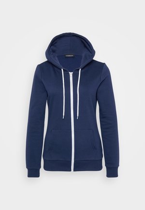 Navy zip-up hoodie with white drawstrings, front pockets, and ribbed cuffs. Soft fabric with a smooth texture, featuring a casual design.
