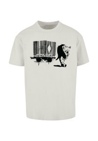 Hvid bomulds t-shirt med et sort abstrakt print af en stregkode og en stiliseret dyresilhuet. Rund hals, korte ærmer, afslappet pasform.