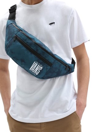 Sac en bandoulière à motif bleu canard avec fermeture éclair noire, arborant un logo "VANS" blanc sur le devant. Fabriqué en matériau léger et durable.