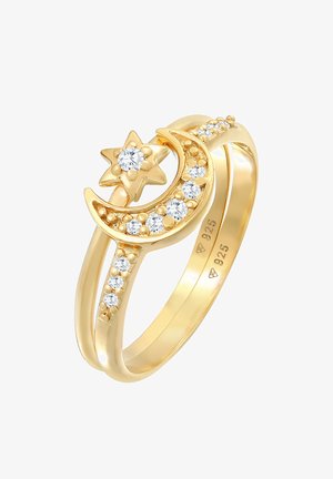 Prstan pozlačen z motivom lune in zvezde, okrašen s prozornimi kristali in teksturiranimi podrobnostmi, označen z "925."