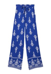 Pantaloni palazzo in tessuto blu royal con intricate fantasie bianche e vita regolabile con fiocco. Texture morbida con tasche.