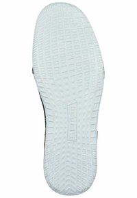 Semelle de chaussure en caoutchouc blanc avec un motif texturé, présentant un logo imprimé et un design à bord arrondi, avec une partie supérieure noire visible.