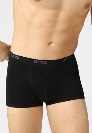 Boxer briefs neri con una morbida fascia elastica decorata con il logo "SLOGGI". Realizzati in tessuto liscio, offrono una vestibilità aderente.